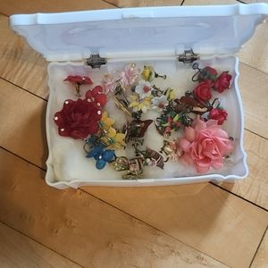 Box full of vintage clip on screw on earrings plastic / celluloid?